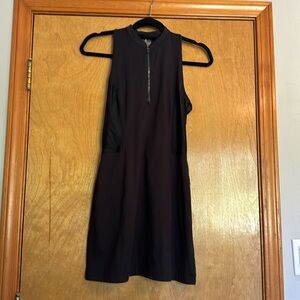 Used black golf athletic dress. Back zipper and front zip up. Size S